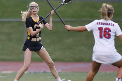 Rian Adkins and Kampbell Stone adjust to drive the Golden Bears girls lacrosse team