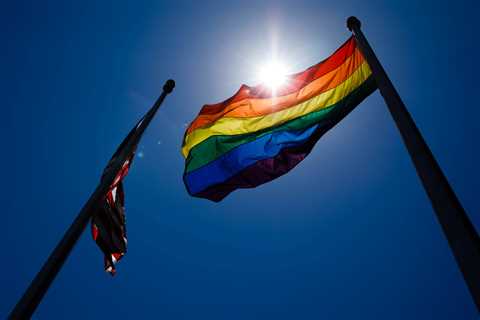 The San Jose Police Division hoist the LGBTQ Satisfaction flag