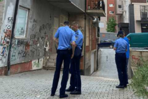 Police and firefighters rescue a person in Pristina after he attempted suicide