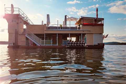 Floating restaurant in New Hampshire is partially submerged in the lake