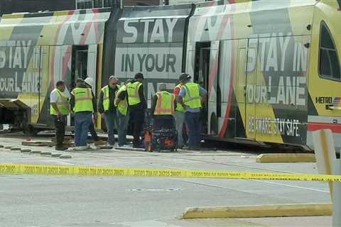 METRORail red line train derails after crash with chase suspect in stolen car on N. Main, HPD says